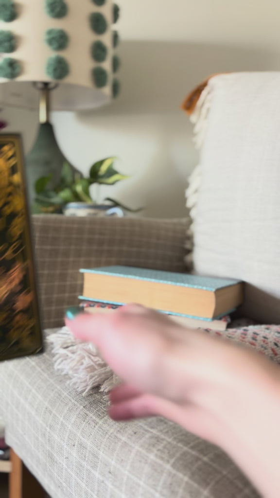 model showcasing pride and prejudice and secret garden book vases